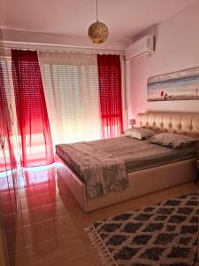 Voodi või voodid majutusasutuse Sunlight Apartment Shkoder toas