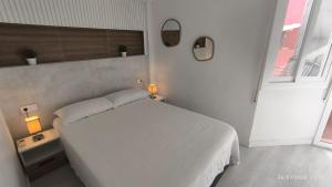 Ένα ή περισσότερα κρεβάτια σε δωμάτιο στο Port 2