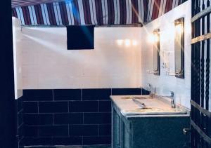 a bathroom with a sink and a mirror at Rum Sky Experiences in Wadi Rum +84 photos