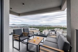 a balcony with furniture and a view of the city at Villa Azzura in Vodice