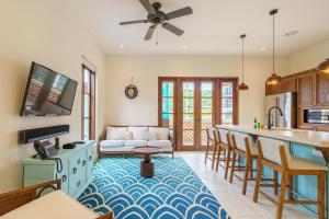 a kitchen and living room with a couch and a table at Casa Brisa At Las Catalinas in Playa Danta