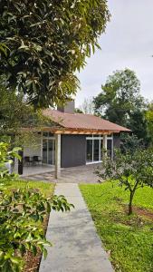 a house with a pathway in front of it at Casa no Bosque in Santa Cruz do Sul