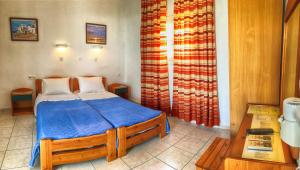 A bed or beds in a room at Hotel Helena