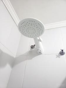 a shower seat in a bathroom with a white ceiling at Apartamento em Condomínio - 2 Dormitórios in Camboriú +23 photos
