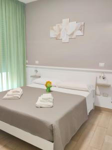 Postel nebo postele na pokoji v ubytování B&B Alle porte del centro
