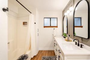 a bathroom with a sink and a mirror at Sleeps 10 Cozy Modern Cabin- 5 minutes to lake, fishing, & hiking in Crestline +34 photos