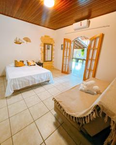 Una cama o camas en una habitación de Rm Hospedagem Ubatuba