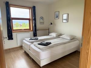 Vuode tai vuoteita majoituspaikassa Guesthouse Myrkholt II