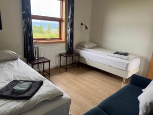 Vuode tai vuoteita majoituspaikassa Guesthouse Myrkholt II