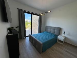 a bedroom with a bed and a large window at Crystal Lagoon White Sands Beach in Punta Cana +14 photos