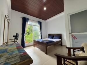 Ένα ή περισσότερα κρεβάτια σε δωμάτιο στο Seetha Homestay Kandy