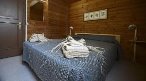 Кровать или кровати в номере Cottage Primula