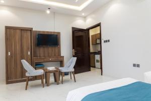 TV a/nebo společenská místnost v ubytování شقق العاتكة السكنية