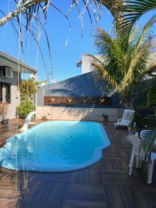 Piscina en o cerca de Edicula com um quarto banheiro e piscina e lazer