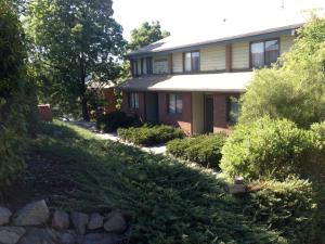a house with a garden in front of it at Lakepines in Jindabyne
