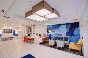 an office lobby with a mural on the wall at Holiday Inn Express Hotel & Suites Chester by IHG in Chester