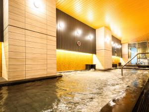 a room with a pool of water on the floor at APA Hotel & Resort Osaka Namba Ekimae Tower in Osaka