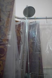 a shower curtain is wrapped in plastic in a bathroom at Main Oak Manor in Gallipolis
