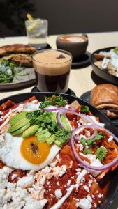 a plate of food with an egg on a table at Espacio Lienzo in Oaxaca City