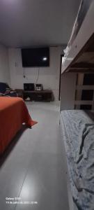 Ένα ή περισσότερα κρεβάτια σε δωμάτιο στο Casa Férias Temporada e Lazer
