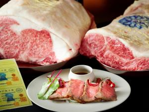 a plate of food with meat on a table at APA Hotel & Resort Osaka Namba Ekimae Tower in Osaka