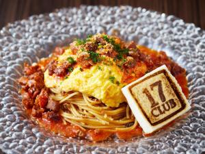 a plate of food with spaghetti and eggs on it at APA Hotel & Resort Osaka Namba Ekimae Tower in Osaka