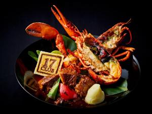 a plate of food with crabs and other foods at APA Hotel & Resort Osaka Namba Ekimae Tower in Osaka