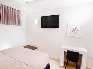 TV a/nebo společenská místnost v ubytování Muna Hotel