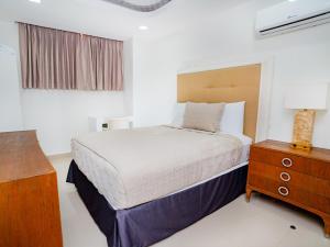 Postel nebo postele na pokoji v ubytování Muna Hotel