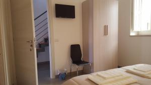 TV a/nebo společenská místnost v ubytování Affittacamere Da Mary + 28 fotografií