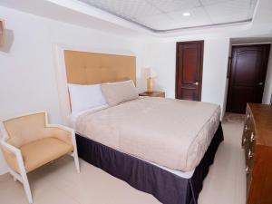 Postel nebo postele na pokoji v ubytování Muna Hotel
