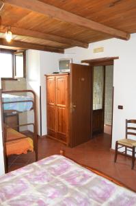 a bedroom with a bed and a bunk bed at Tenuta le Cascine in Casalbuono