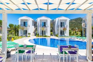 a view of a villa with a swimming pool at Kalina Hotel in Datca