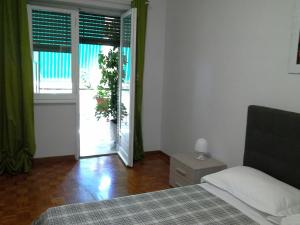 Posteľ alebo postele v izbe v ubytovaní Olimpica Relais guest house