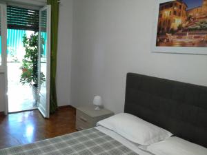 Posteľ alebo postele v izbe v ubytovaní Olimpica Relais guest house
