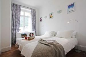 a bedroom with two beds and a window at Alpine Museum- Chamonix All Year in Chamonix