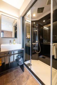a bathroom with a sink and a shower at HOTEL TABARD TOKYO - Vacation STAY 64570v in Tokyo