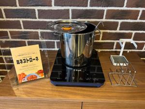 a blender sitting on top of a wooden counter at HOTEL TABARD TOKYO - Vacation STAY 64570v in Tokyo +11 photos
