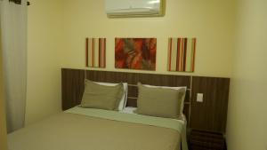 Postel nebo postele na pokoji v ubytování Residencial Portinari LTDA + 37 fotografií