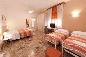 Postel nebo postele na pokoji v ubytování Gardenia Guest House