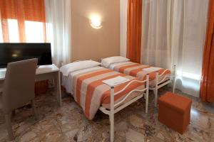 Postel nebo postele na pokoji v ubytování Gardenia Guest House