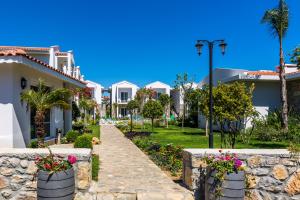 a walkway in front of some houses at Kalina Hotel in Datca