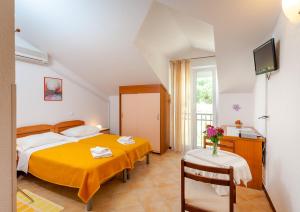 Posteľ alebo postele v izbe v ubytovaní Guest House Davor Tomas