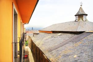 a building with a tower on top of a roof at Hotel Los Templarios in Ponferrada