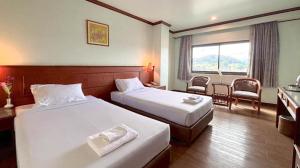 Postel nebo postele na pokoji v ubytování Sri Betong Hotel + 29 fotografií