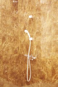 a shower with a shower head in a bathroom at 台東区 駅から徒歩3分施設a4f in Tokyo