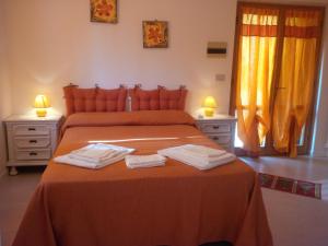 Postel nebo postele na pokoji v ubytování Il Gelsomino Bio Agriturismo + 28 fotografií