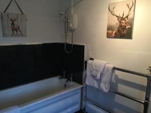 Postel nebo postele na pokoji v ubytování Sandhill House