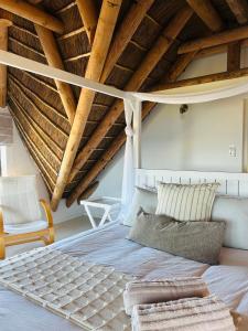 Postel nebo postele na pokoji v ubytování Quill Cottage