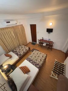 Postel nebo postele na pokoji v ubytování Paradise Inn
